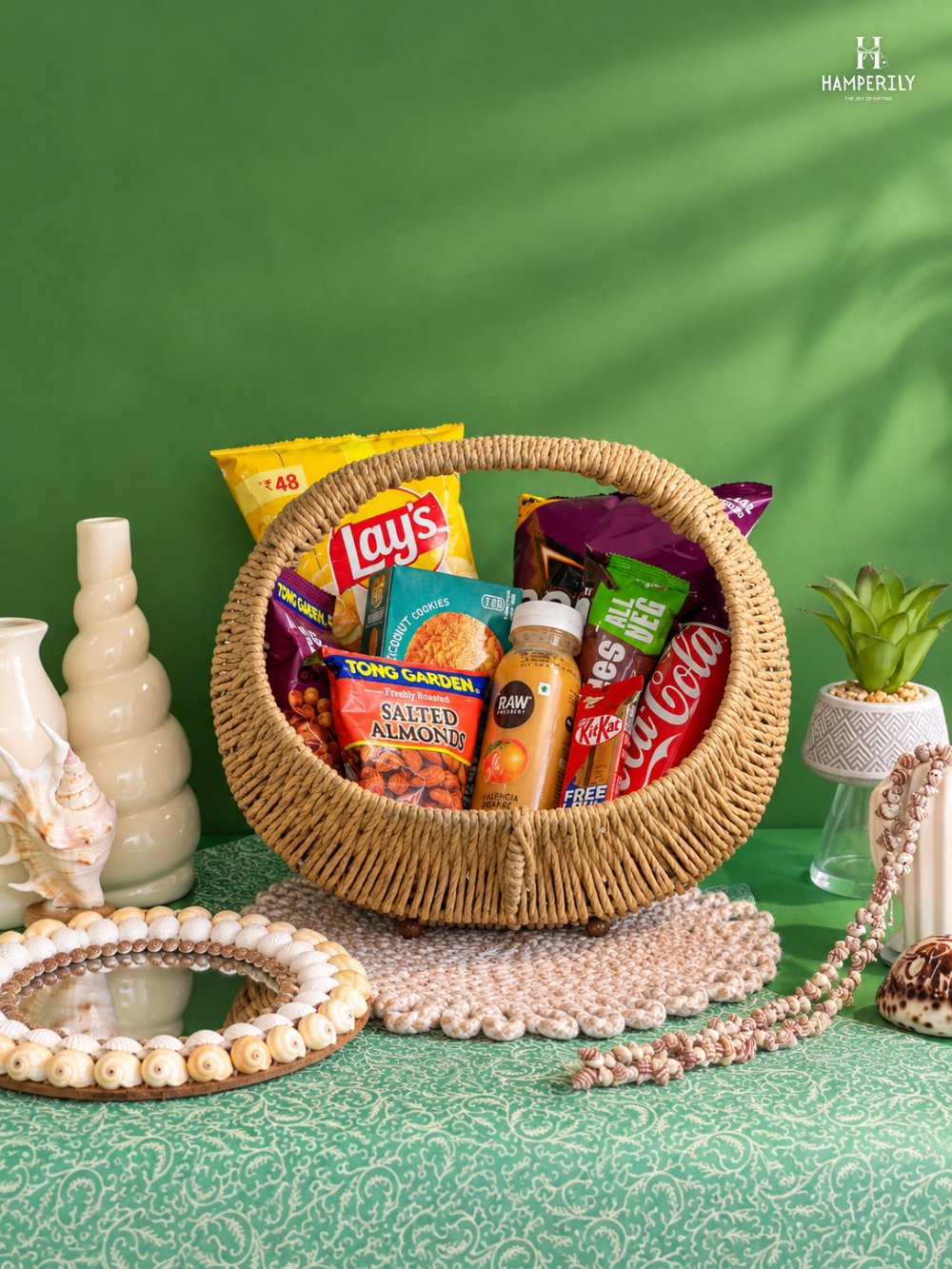 Round wicker basket hamper with snacks